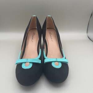 Brechelle's black suede wedge heels with turquoise accents